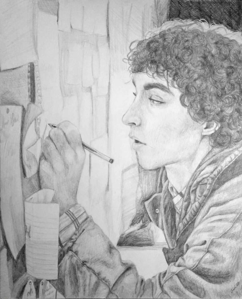 A graphite portrait of a figure in profile. The figure has curly hair and is facing a wall of papers pinned to a cork board. They hold a pen and are marking one of the papers on the wall.